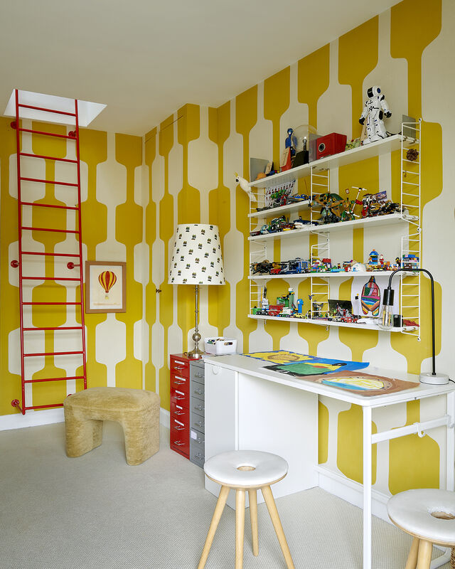A child's room with a desk. A child's room with a desk.