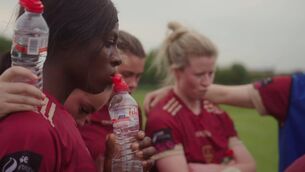 <p>Players with Galway United women's soccer team huddle after a match, in new RTÉ1 series Pass It On: Sacar na mBan</p>