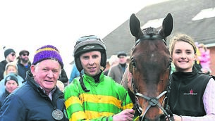 <p>FEELGOOD STORY: Trainer Jimmy Mangan, jockey Mark Walsh, and groom Chloe Dreaper savour the moment after Spillane’s Tower struck Grade One gold at Fairyhouse last Sunday.	<span class="contextmenu emphasis CaptionCredit"> Picture: Healy Racing</span>
            </p>