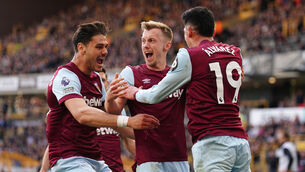 West Ham United’s James Ward-Prowse (centre) celebrates with Konstantinos Mavropanos (left) and Edson Alvarez after scoring their second goal of the game during the Premier League match at Molineux, Wolverhampton. Picture date: Saturday April 6, 2024.