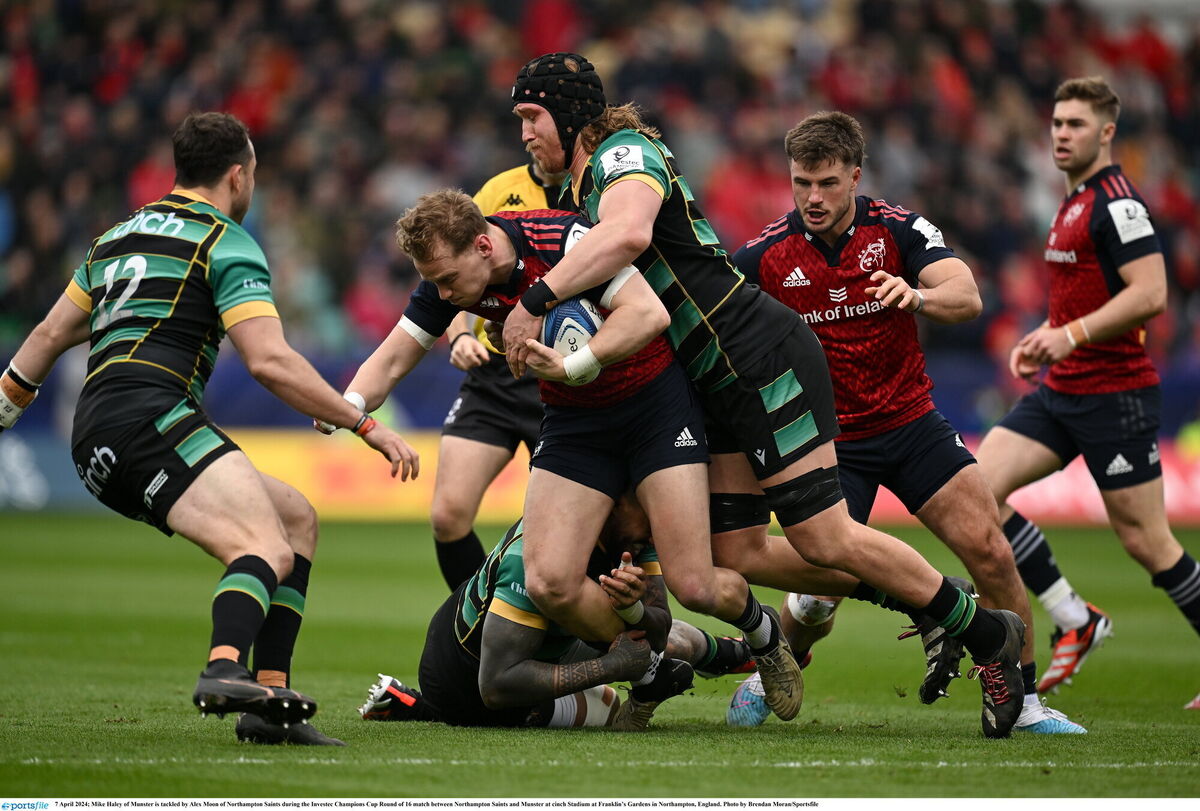Mike Haley of Munster is tackled by Alex Moon of Northampton Saints. Pic: Brendan Moran/Sportsfile