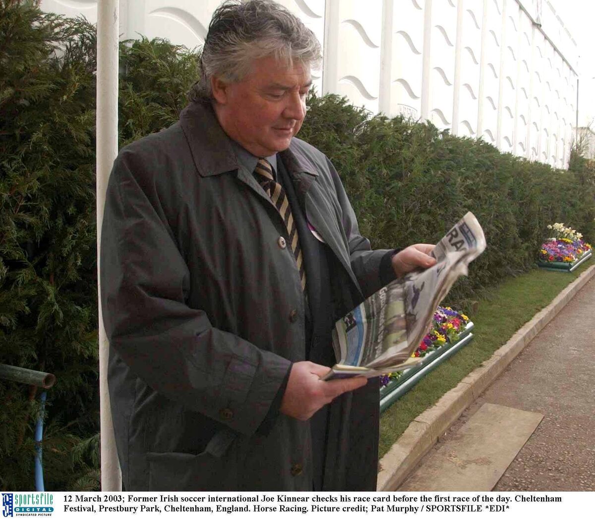 Former Irish soccer international Joe Kinnear checks his race card before the first race of the day. Cheltenham Festival, Prestbury Park, Cheltenham, England. Horse Racing. Picture credit; Pat Murphy / SPORTSFILE *EDI* 