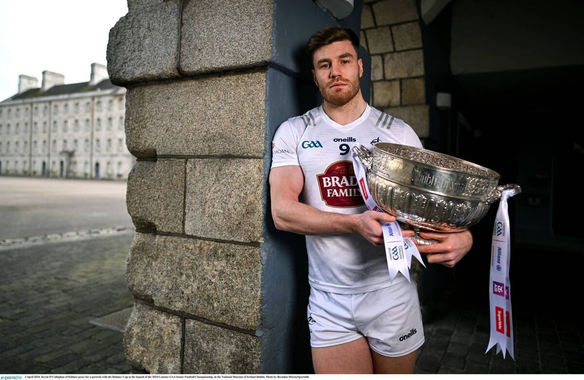 Kevin O'Callaghan of Kildare poses for a portrait with the Delaney Cup at the launch of the 2024 Leinster SFC, in the National Museum of Ireland Dublin. Picture: Brendan Moran/Sportsfile Kevin O'Callaghan of Kildare poses for a portrait with the Delaney Cup at the launch of the 2024 Leinster SFC, in the National Museum of Ireland Dublin. Picture: Brendan Moran/Sportsfile