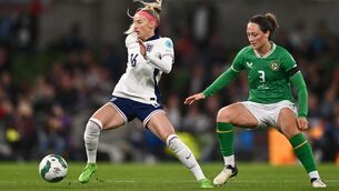 <p>Chloe Kelly in action against Megan Campbell.</p>