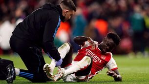 <p>SAKA CON?: Arsenal's Bukayo Saka receives treatment. Photo credit: John Walton/PA Wire.</p>