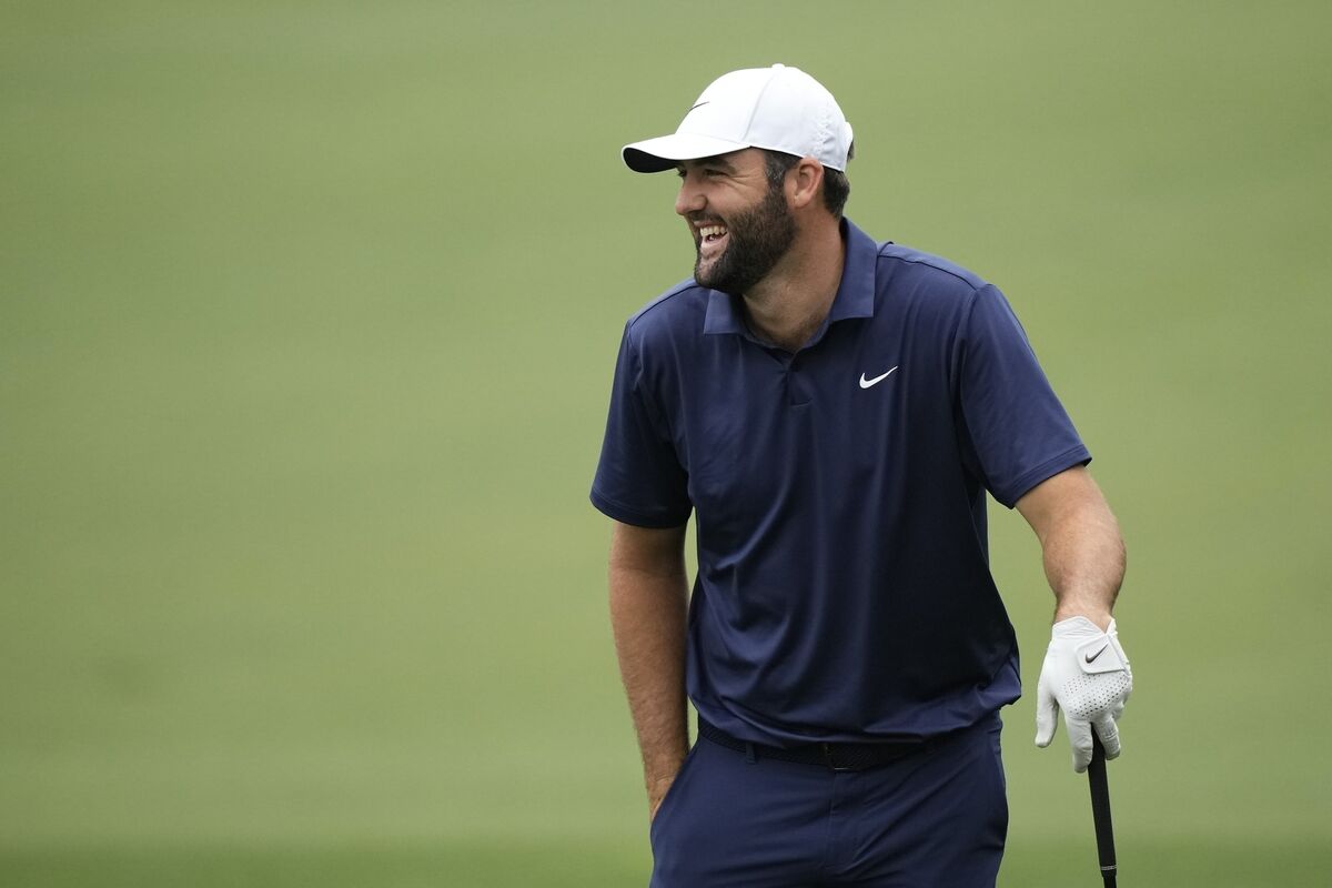 Scottie Scheffler laughs on the driving range during a practice round in preparation for the Masters. Pic: Charlie Riedel, AP
