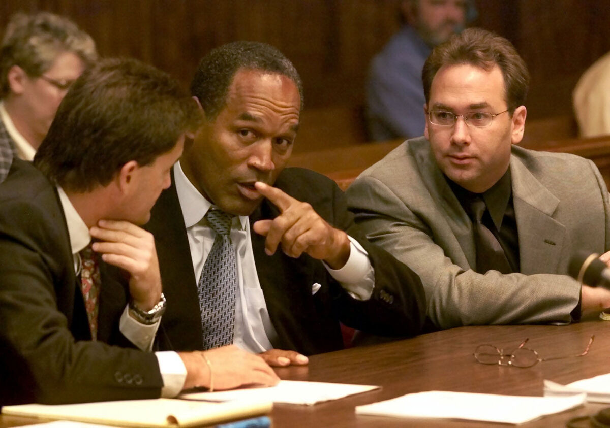 OJ Simpson, center, gestures as he talks with his attorneys Yale Galanter, left, and Craig Brand in Miami circuit court Wednesday, Oct. 10, 2001, in Miami, for the second day of jury selection for his trial. Picture: AP Photo/Wilfredo Lee