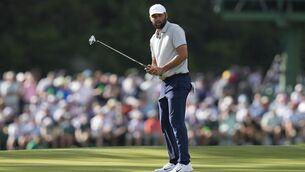 <p>Scottie Scheffler reacts after missing a putt on the 15th hole. Pic: AP Photo/David J. Phillip</p>