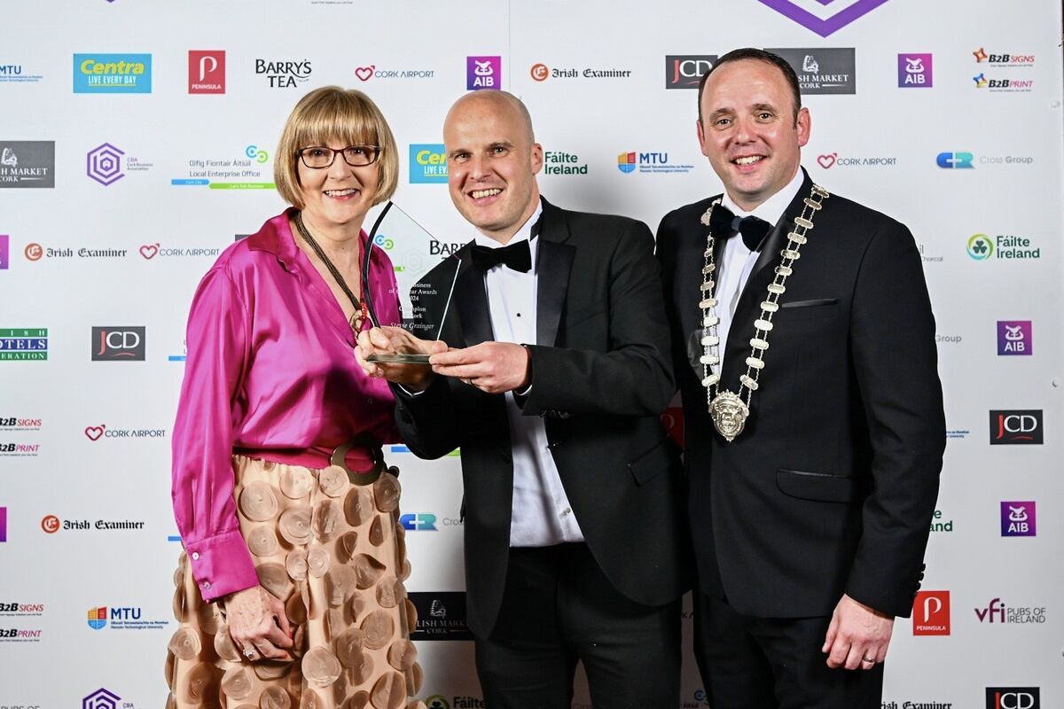 Maggie Cusack from MTU and CBA President Aaron Mansworth pictured with Stevie Grainger who was awarded as the Champion of Cork at the Cork Business Association’s Cork Business of the Year Awards.  Corkbusness.ie Picture Chani Anderson