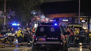 Emergency officers outside Westfield Shopping Centre in Sydney (Rick Rycroft/PA)