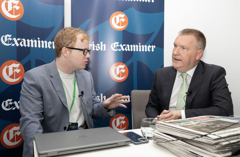  Irish Examiner Political Reporter Paul Hosford talking with Finance Minister Michael McGrath at the Irish Examiner stand during the Fianna Fáil ard fheis. Photo: Gareth Chaney