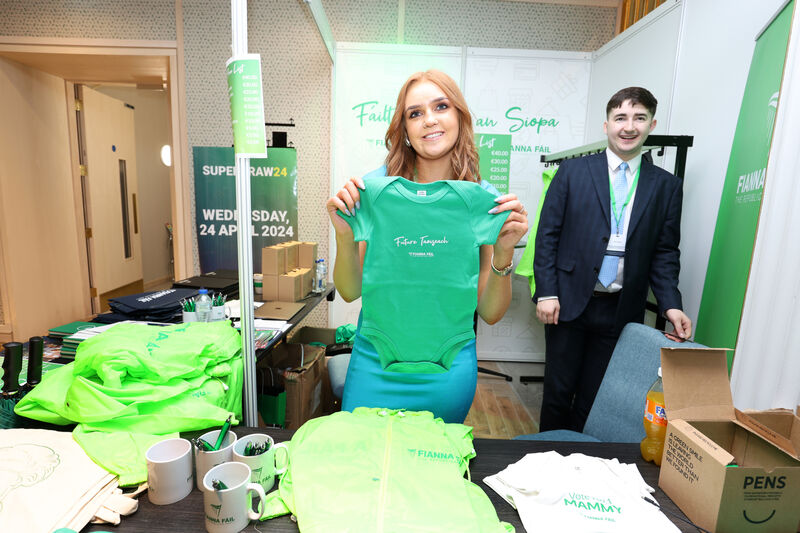 Claire Taylor with a babygro bearing the legend ‘Future Taoiseach — Fianna Fáil’ at the merchandise stand during the ard fheis. Picture: Leah Farrell/RollingNews