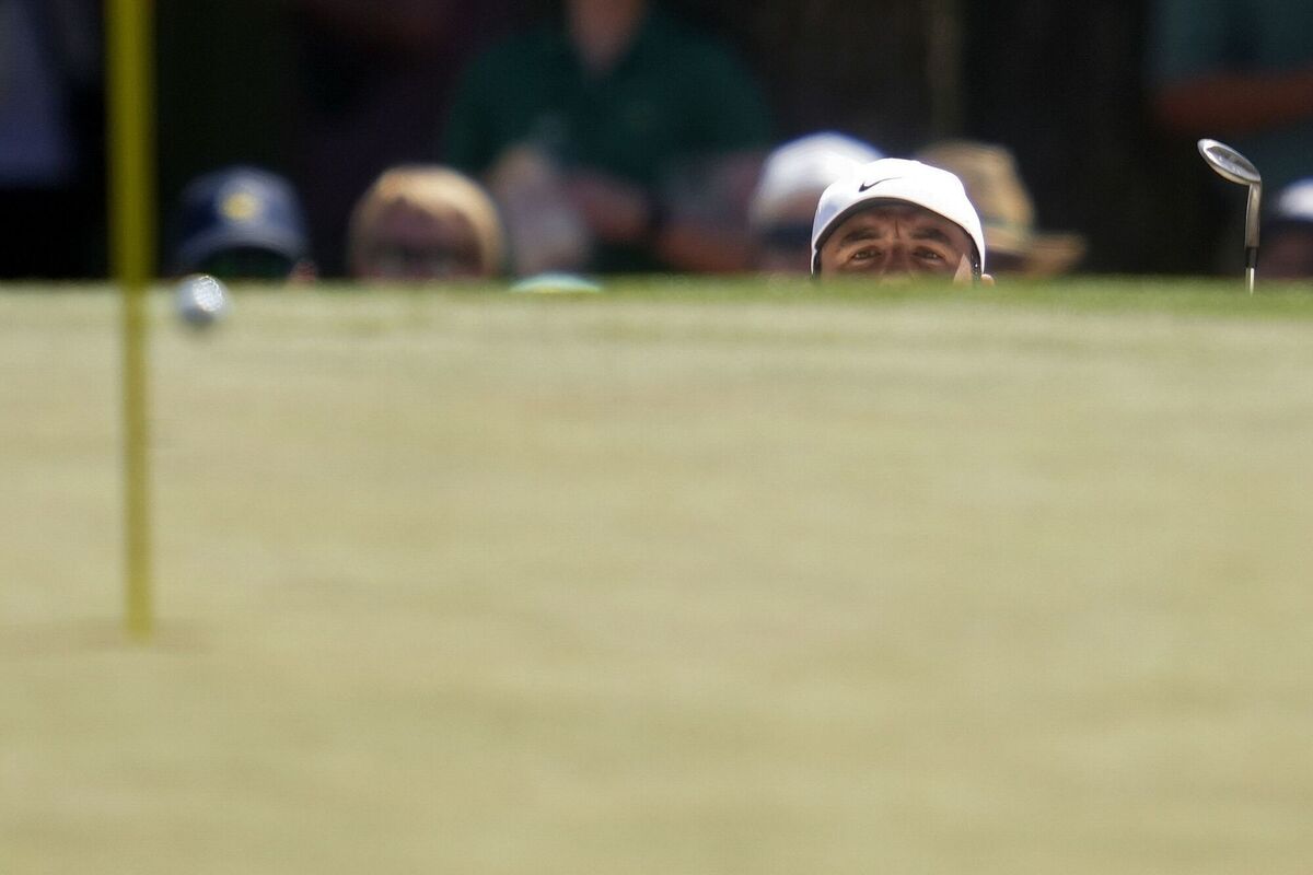 Scottie Scheffler chips to the green on the third hole during the final round. Pic: Ashley Landis, AP