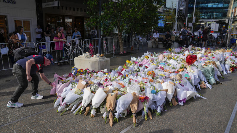A man places flowers as a tribute near a crime scene at Bondi Junction in Sydney, Monday, April 15, 2024, after several people were stabbed to death at a shopping on April 13. Picture: AP Photo/Mark Baker A man places flowers as a tribute near a crime scene at Bondi Junction in Sydney, Monday, April 15, 2024, after several people were stabbed to death at a shopping on April 13. Picture: AP Photo/Mark Baker