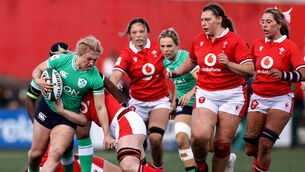 <p>Ireland's Neve Jones is tackled by Abbie Fleming of Wales. Picture: ©INPHO/Ben Brady</p>