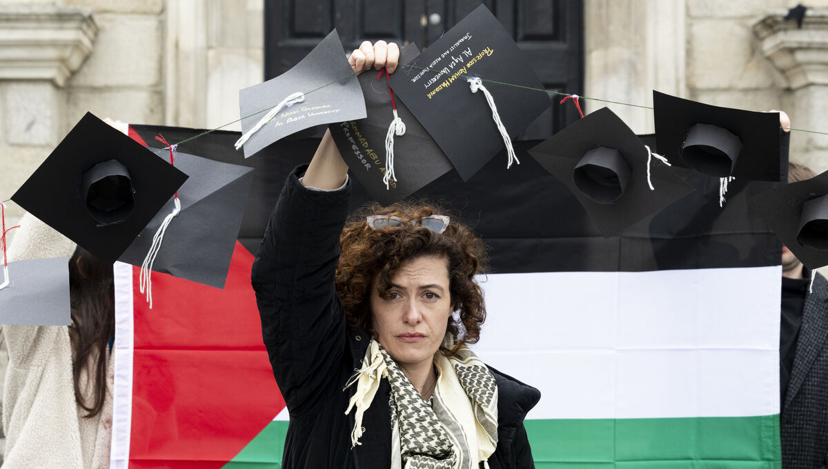 Claire O’Reilly joins protesters from Trinity College Dublin holding a demonstration, on the day where students will graduate from the university, in solidarity with the Palestinian people. Picture: Sam Boal/Collins Claire O’Reilly joins protesters from Trinity College Dublin holding a demonstration, on the day where students will graduate from the university, in solidarity with the Palestinian people. Picture: Sam Boal/Collins