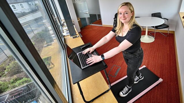 <p>Denise O’Donoghue multitasks by catching up on work emails while exercising on her walking pad. Picture: Chani Anderson</p>