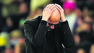 <p>MALFUNCTION: Pep Guardiola during the second leg at the Etihad.</p>