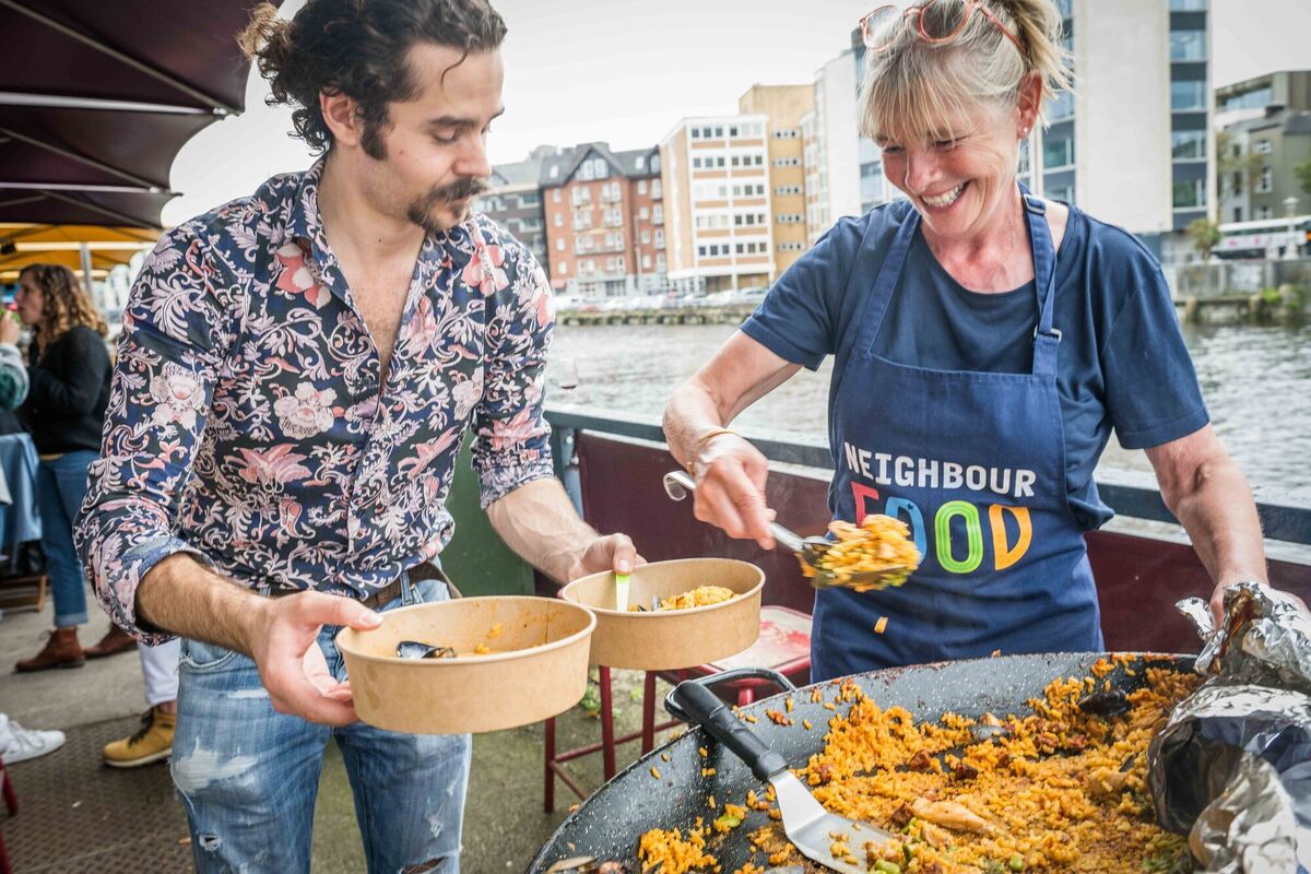  Leonardo Romano and Simone Kelly working at "Cork in a Paella!" during Cork on a Fork Fest.