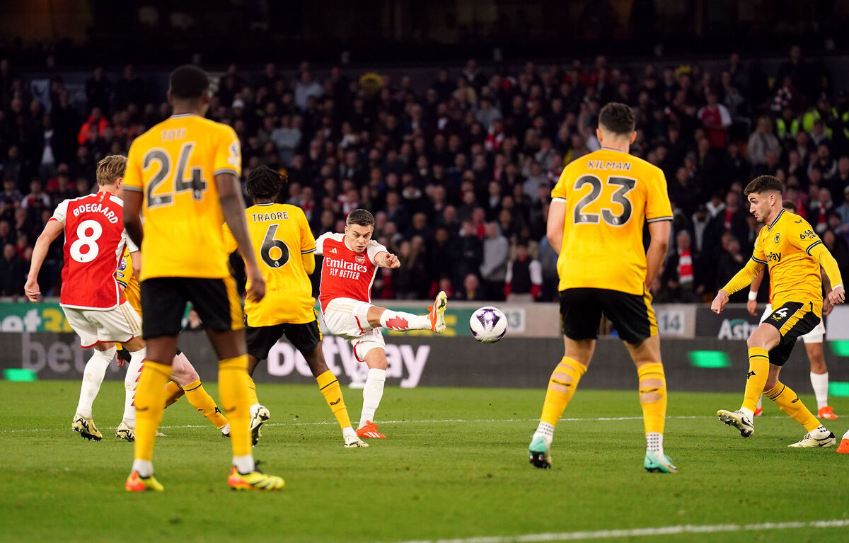 Arsenal's Leandro Trossard scores their side's first goal. Photo credit: Mike Egerton/PA Wire.