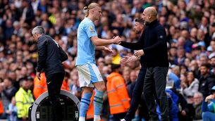 <p>TOUGH LOVE: Manchester City's Erling Haaland (left) shakes hands with manager Pep Guardiola after being substituted. Photo credit: Martin Rickett/PA Wire.</p>