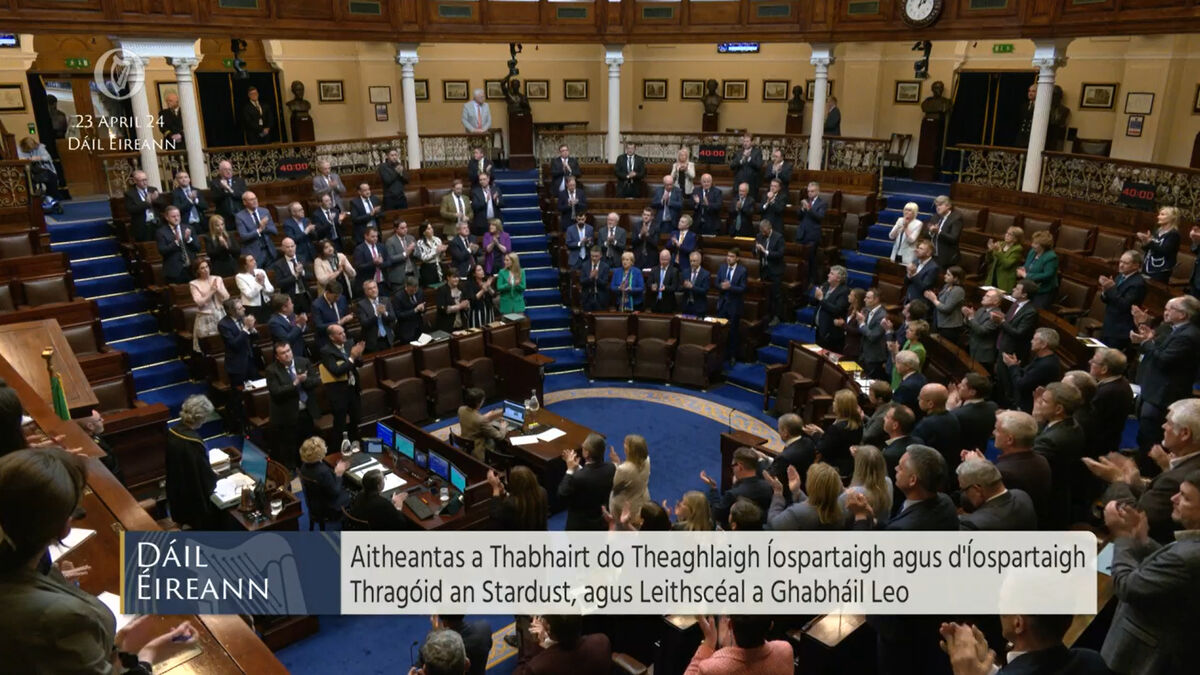 TDs applaud the families of the victims of the Stardust fire. Picture: Oireachtas TV/PA TDs applaud the families of the victims of the Stardust fire. Picture: Oireachtas TV/PA
