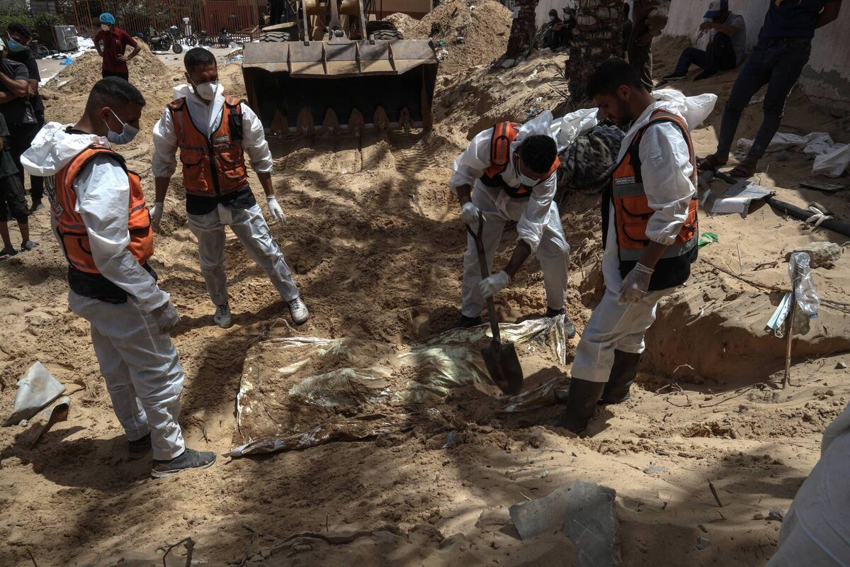 Health workers unearth bodies found at Nasser Hospital in Khan Yunis in the southern Gaza Strip on Tuesday. Picture: AFP/Getty