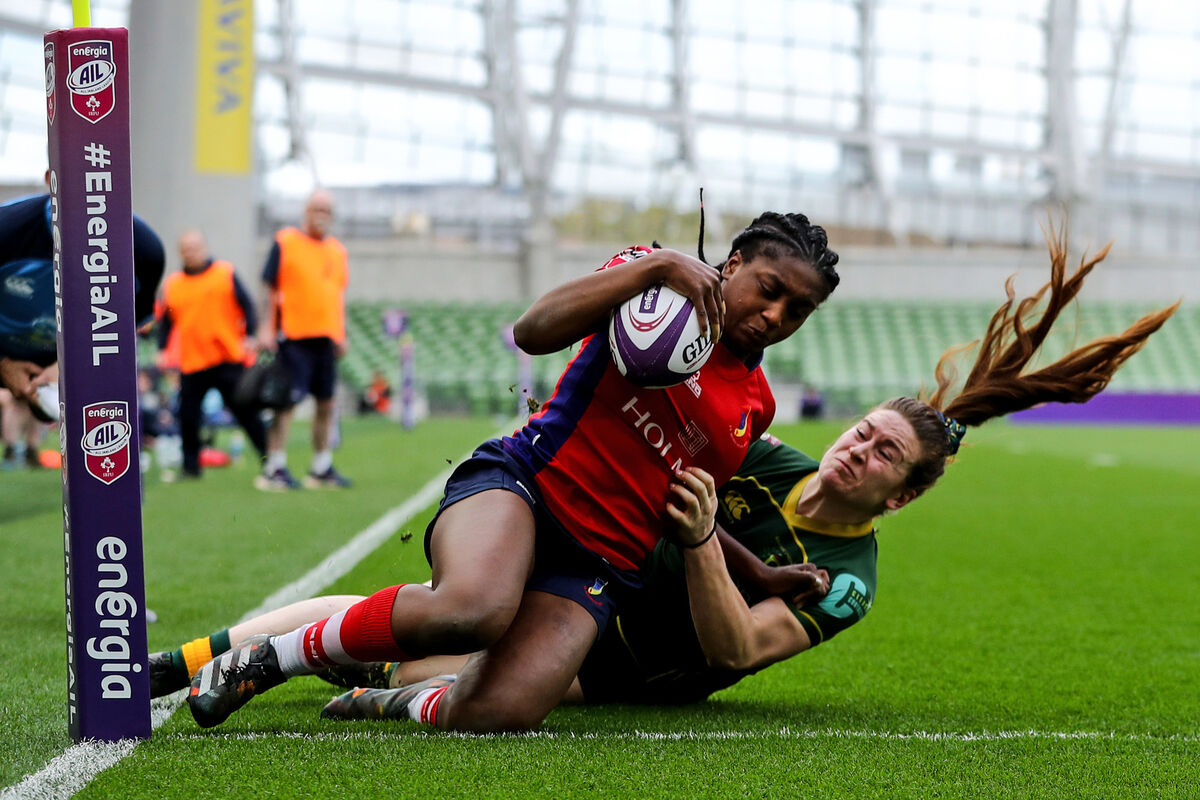 UL Bohemians' Chisom Ugwueru scores her team's fourth try despite Maddy Aberg of Railway Union 