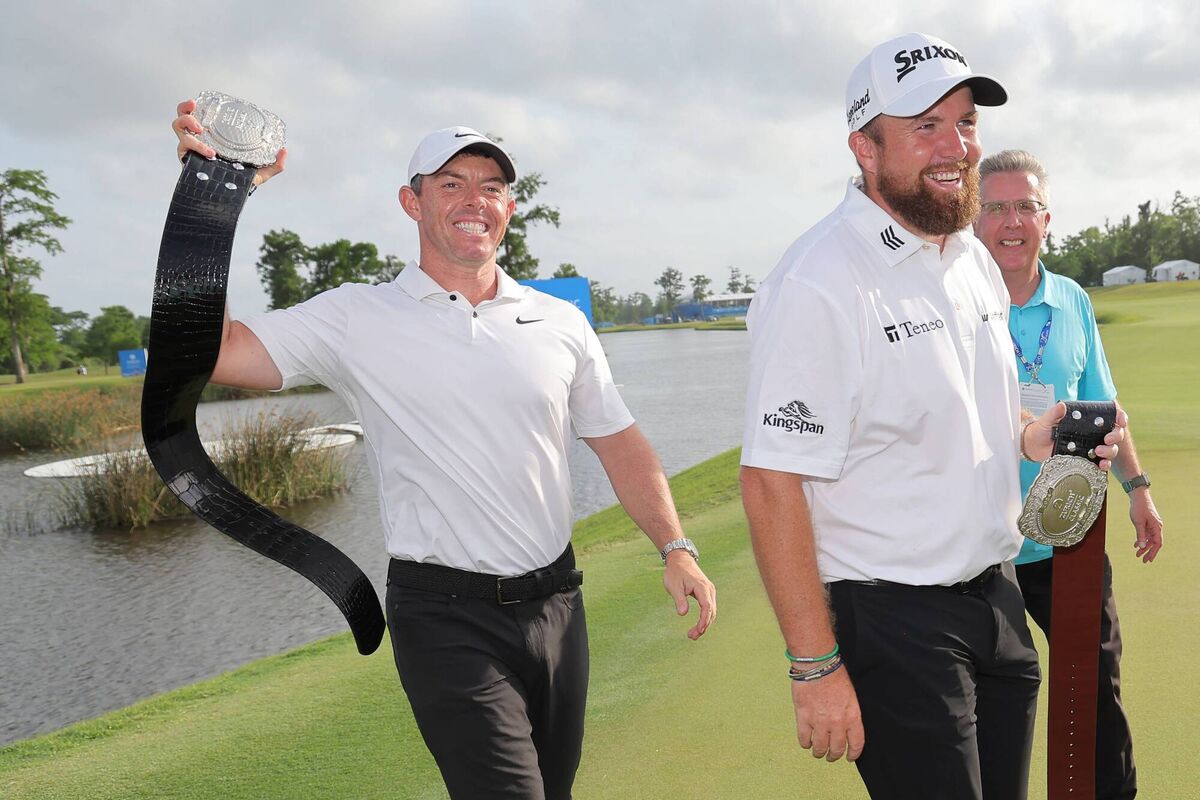 McIlroy and Lowry pose with the trophy.