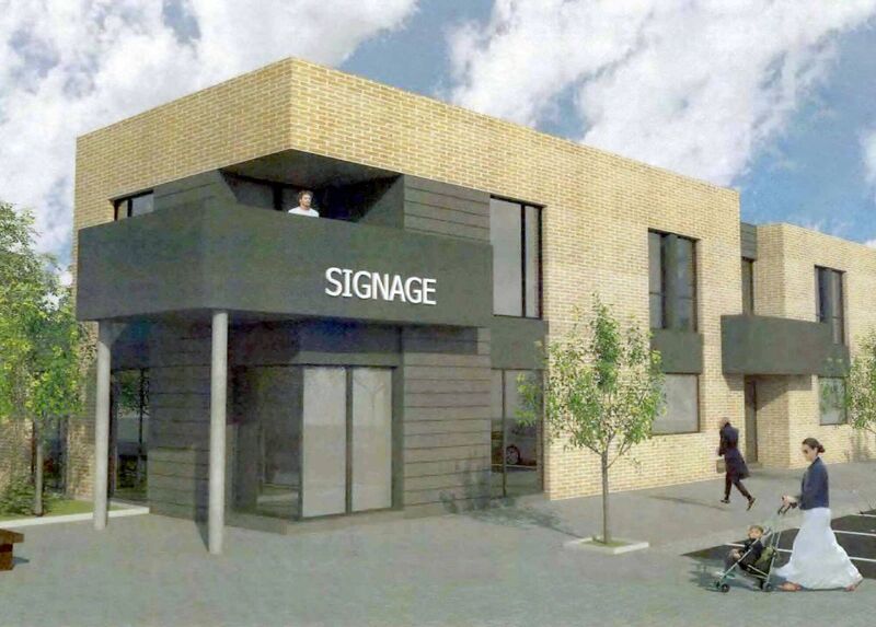 The cafe, pharmacy and apartments.