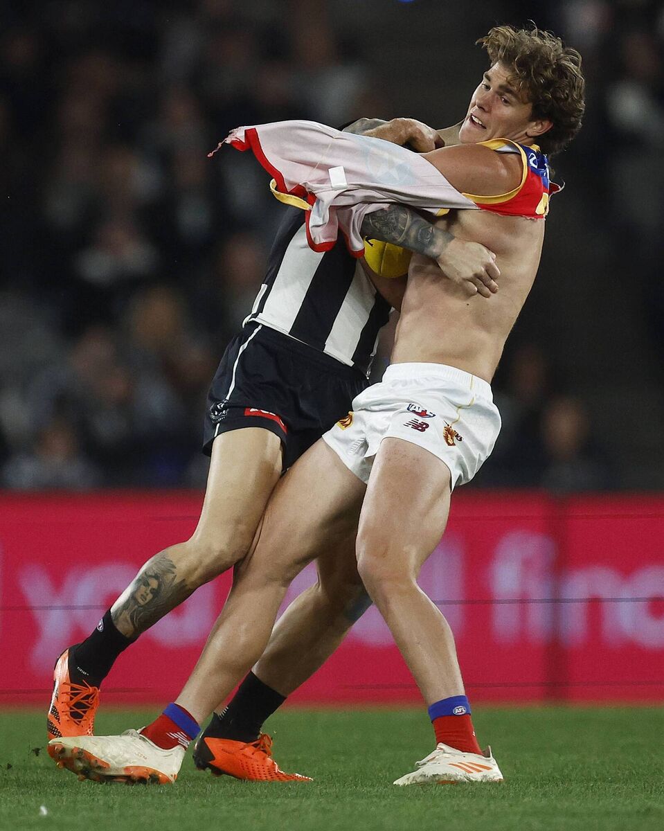 Lions Deven Robertson is tackled by Magpies Jamie Elliott during the round 23 AFL match in Melbourne, Australia. Pic: Daniel Pockett/Getty Images) Lions Deven Robertson is tackled by Magpies Jamie Elliott during the round 23 AFL match in Melbourne, Australia. Pic: Daniel Pockett/Getty Images)