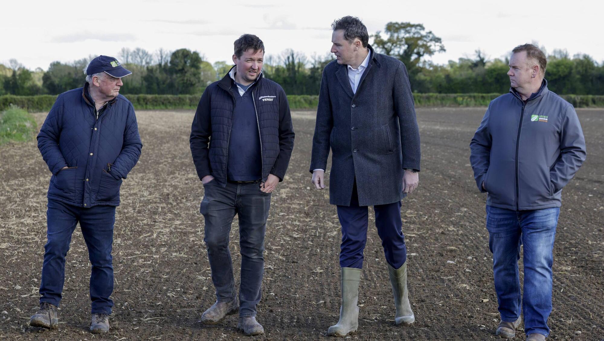 Agriculture Minister Charlie McConalogue with landowners Pat Cleary and Darragh Cleary and Bobby Miller, chairman of Irish Grain Growers Group, in Ballybrittas, Co Laois. The field had a failed crop of winter wheat and was redrilled with spring barley. Picture: Maxwell Photography