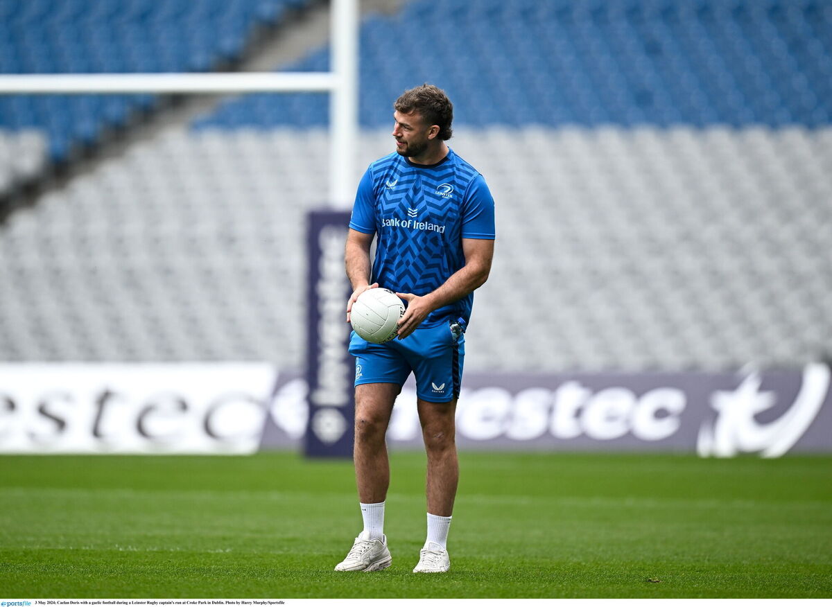 Caelan Doris with a gaelic football during a Leinster Rugby captain's run at Croke Park in Dublin. Photo by Harry Murphy/Sportsfile