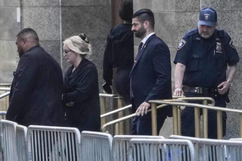 Stormy Daniels, second from left, exits the courthouse in New York, Tuesday, May 7, 2024. Porn actor Daniels, whose real name is Stephanie Clifford, took the stand mid-morning Tuesday and testified about her alleged sexual encounter with Trump in 2006, among other things. Picture: AP Photo/Seth Wenig