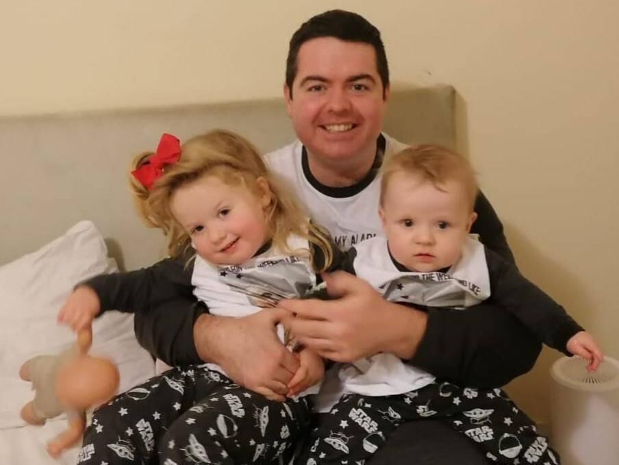 Bryan with his children Elle, 6, and 11-month-old Ty. 