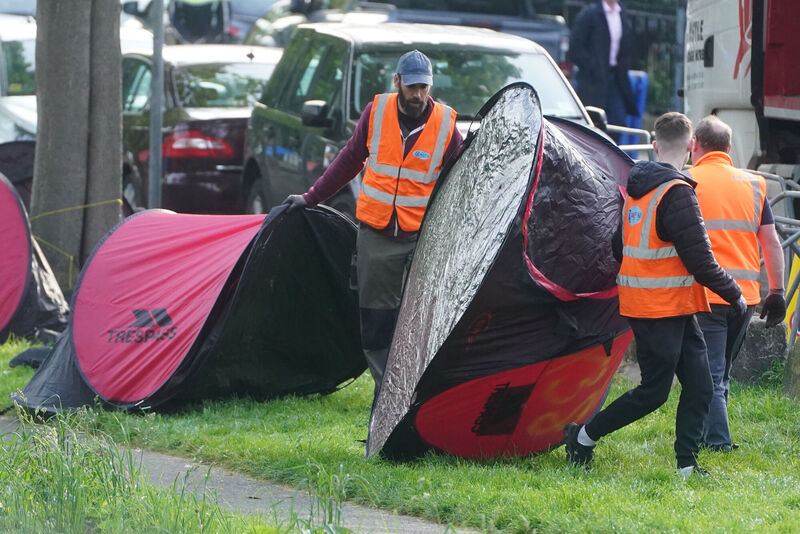 An early morning operation to remove tents which have been pitched by asylum seekers along a stretch of the Grand Canal, Dublin. Picture: Brian Lawless/PA Wire