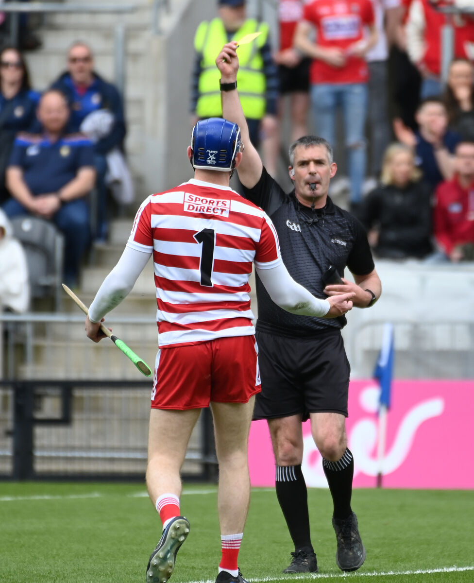DISCIPLINE: Cork goalkeeper Patrick Collins gets a yellow card from referee James Owens