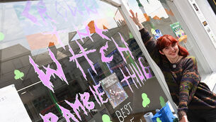 <p> Sophie Corcoran was busy decorating the window  of her eSmoke Store in support of Bambie Thug'a appearance in the final of the Eurovision Song Contest on Saturday night. The town of Macroom is planning an outdoor 'watch party' in the town square from 7pm on Saturday night . Picture: Larry Cummins</p>
