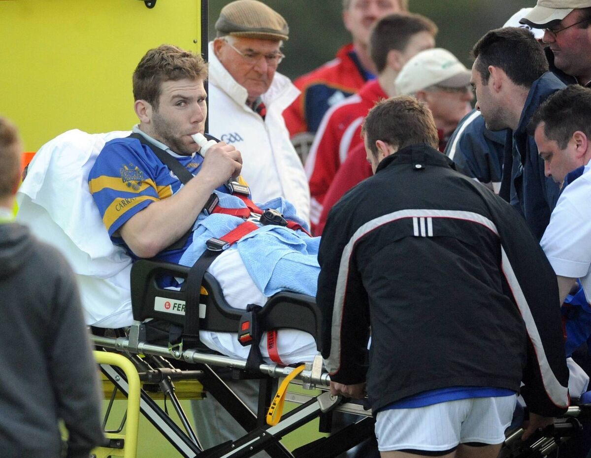 Paudie O'Sullivan leaves the pich by ambulance after badly injuring his leg playing for Imokilly against CIT during the 2013 Cork SHC at Carrigtwohill last night. Picture: Eddie O'Hare Paudie O'Sullivan leaves the pich by ambulance after badly injuring his leg playing for Imokilly against CIT during the 2013 Cork SHC at Carrigtwohill last night. Picture: Eddie O'Hare