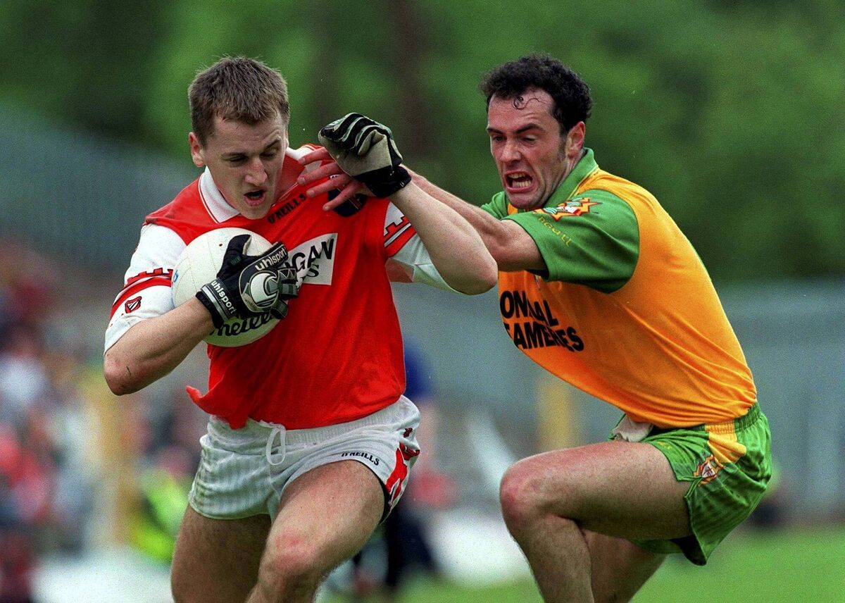 Paddy McKeever of Armagh is tackled by Damien Diver of Donegal in Clones in 1999. Pic: Ray Lohan/Sportsfile Paddy McKeever of Armagh is tackled by Damien Diver of Donegal in Clones in 1999. Pic: Ray Lohan/Sportsfile