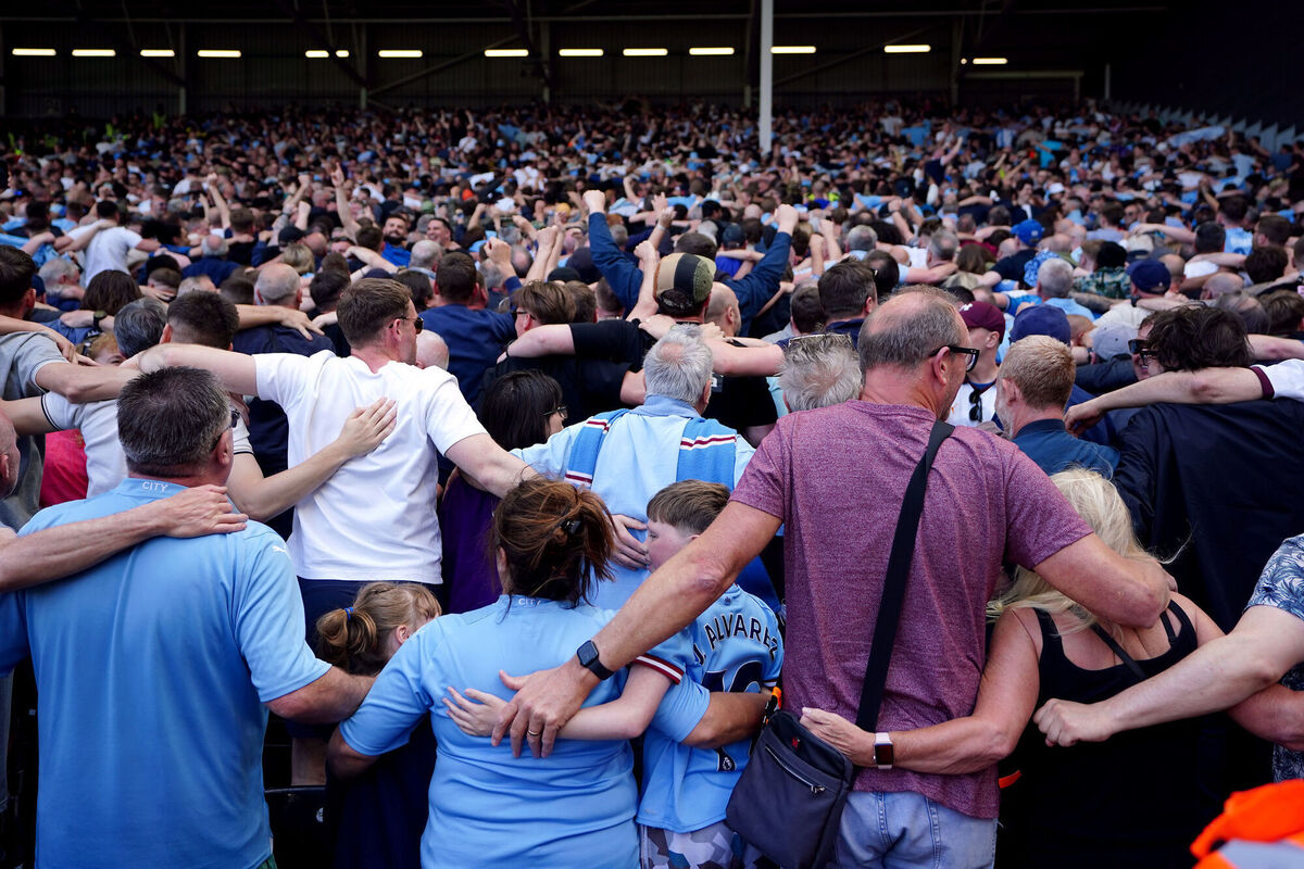 PARTY TIME: Manchester City fans perform the Poznan in the stands. Pic: Zac Goodwin/PA Wire. PARTY TIME: Manchester City fans perform the Poznan in the stands. Pic: Zac Goodwin/PA Wire.