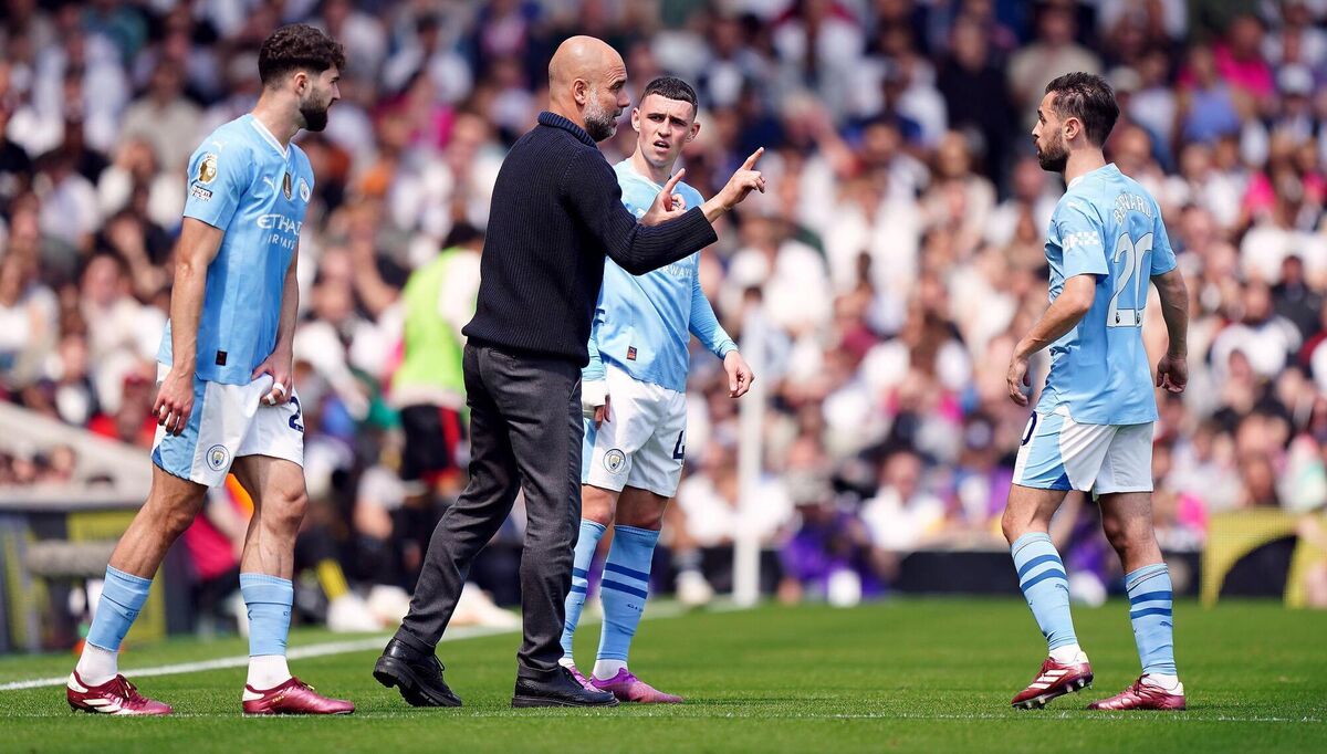 Manchester City manager Pep Guardiola gives instructions to Bernardo Silva during the Premier League against Fulham. Picture: Zac Goodwin/PA Wire.