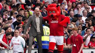 <p>Manchester United manager Erik ten Hag and mascot Fred the Red. Picture: Martin Rickett/PA Wire.</p>