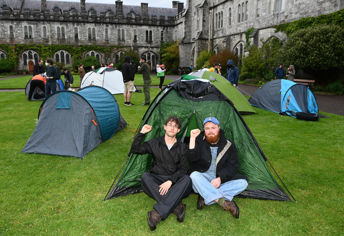 
                        Mikey Rose (left) and Morgan Hegarty UCC BDS in one of the tents after setting up the encampment on the quad at UCC Picture: Eddie O'Hare
                    