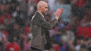 <p>WHEN IT RAINS, IT POURS: Erik ten Hag, Manager of Manchester United, leaves the field in the rain following defeat to Arsenal. Photo by Stu Forster/Getty Images.</p>