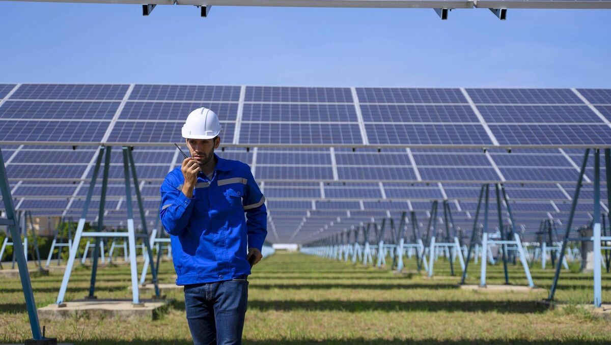 Employee is working at solar farm. New alternatives and environment concept. Thailand aims to draw 35% of its energy from non-fossil fuels by 2037. It is creating one of the world's biggest floating hydro solar hybrid projects on the surface of a dam, which is close to completion. The state-run Electricity Generation Authority of Thailand (EGAT) aims to replicate this at eight more dams in the coming years. Employee is working at solar farm. New alternatives and environment concept. Thailand aims to draw 35% of its energy from non-fossil fuels by 2037. It is creating one of the world's biggest floating hydro solar hybrid projects on the surface of a dam, which is close to completion. The state-run Electricity Generation Authority of Thailand (EGAT) aims to replicate this at eight more dams in the coming years.