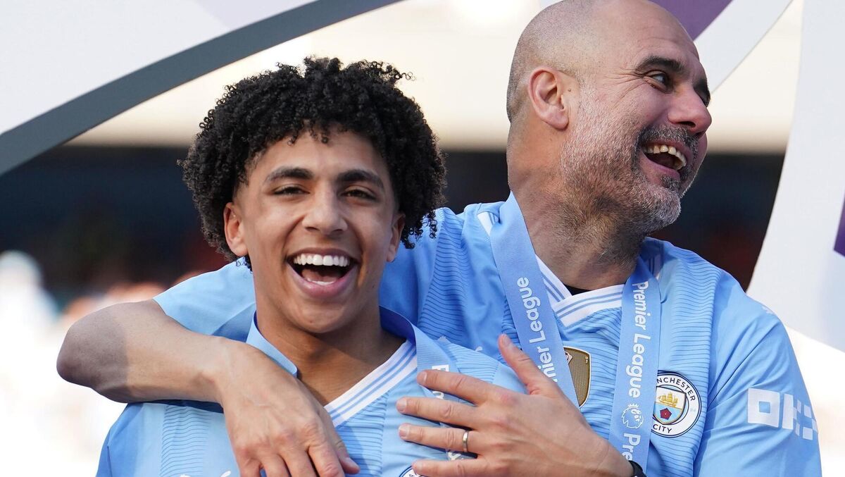Manchester City manager Pep Guardiola celebrating with Rico Lewis after the Premier League match at the Etihad Stadium. Photo: Martin Rickett/PA Wire. 
