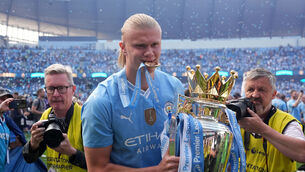 <p>Manchester City's Erling Haaland celebrates with the Premier League trophy. Pic: Martin Rickett, PA Wire.</p>
