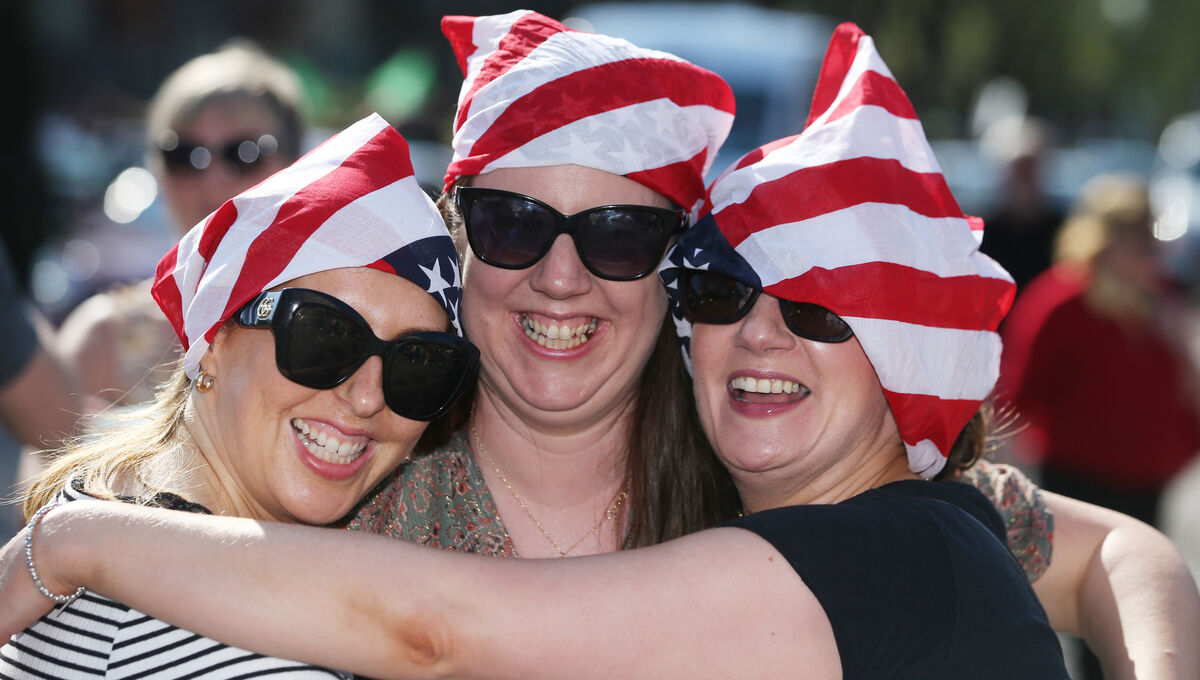 Bruce Springsteen fans Helena Sheehan,Catherine Carroll, and Julie Mclaughlin adorned with US flags for the gig in Dublin. Picture: Collins