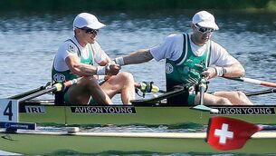 <p>Fintan McCarthy, left, and Paul O'Donovan of Ireland celebrate after winning gold in the Lightweight Men's Double Sculls Final A during the 2023 World Rowing Championships. Photo by Nikola Krstic/Sportsfile</p>